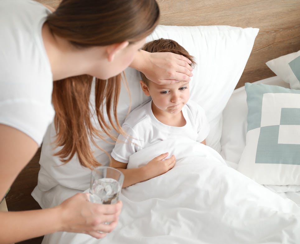 Mother looking after her sick child