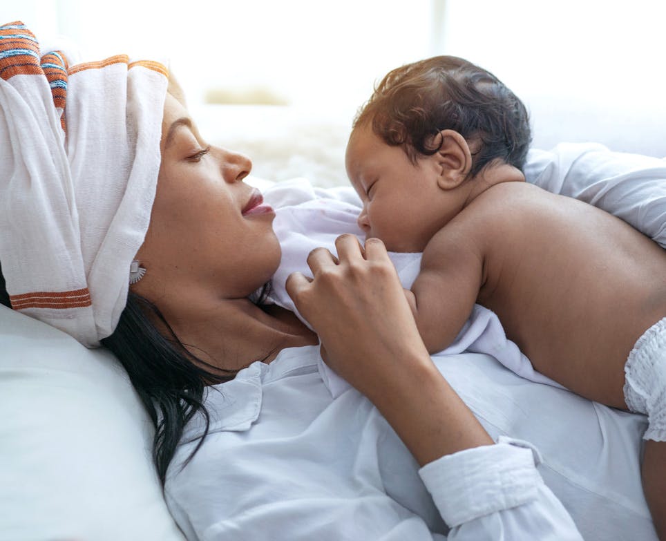 Baby sleeping on mother