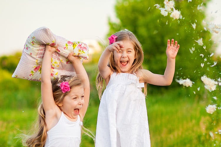 Two Kids Playing with the pillow