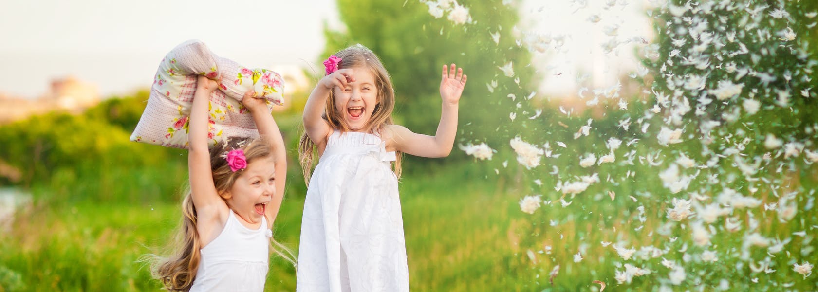 Two Kids Playing With The Pillow