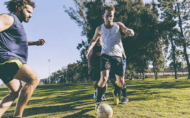 Men Playing A Game Of Soccer