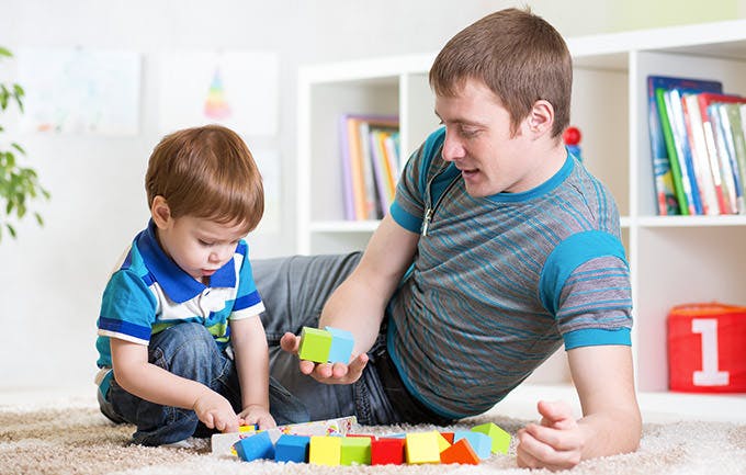 Dad With His Son Play Together At Home Dad With His Son Play Together At Home