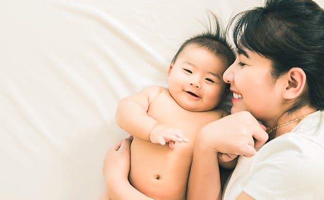 Mother Reading With Young Daughter