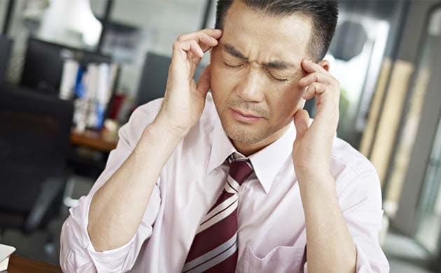 Office worker experiencing headache