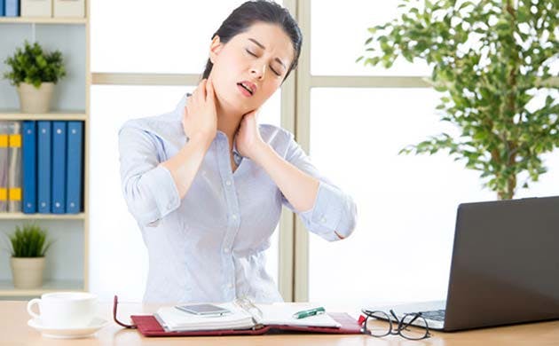 Woman in office with neck ache