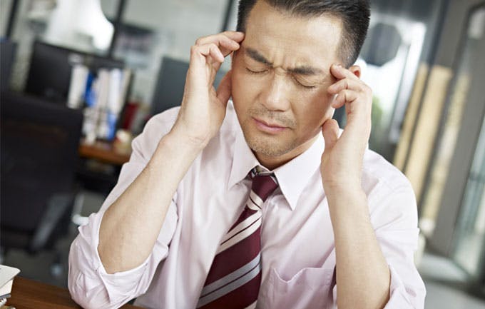 Office worker experiencing headache