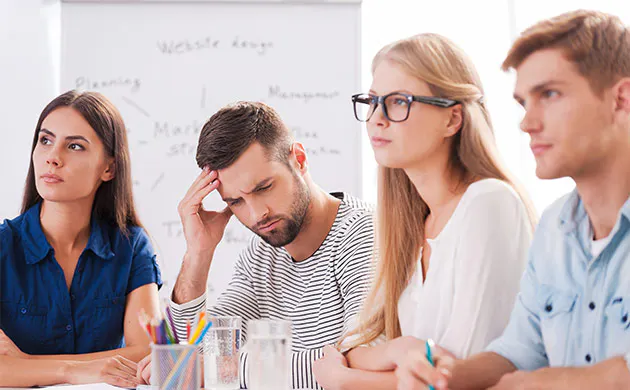 Friends Laugh As They Pile On Top Of Each Other During A Camping Trip&nbsp;