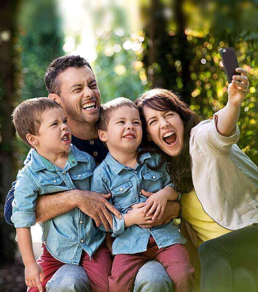 Parents With Children Taking Selfie