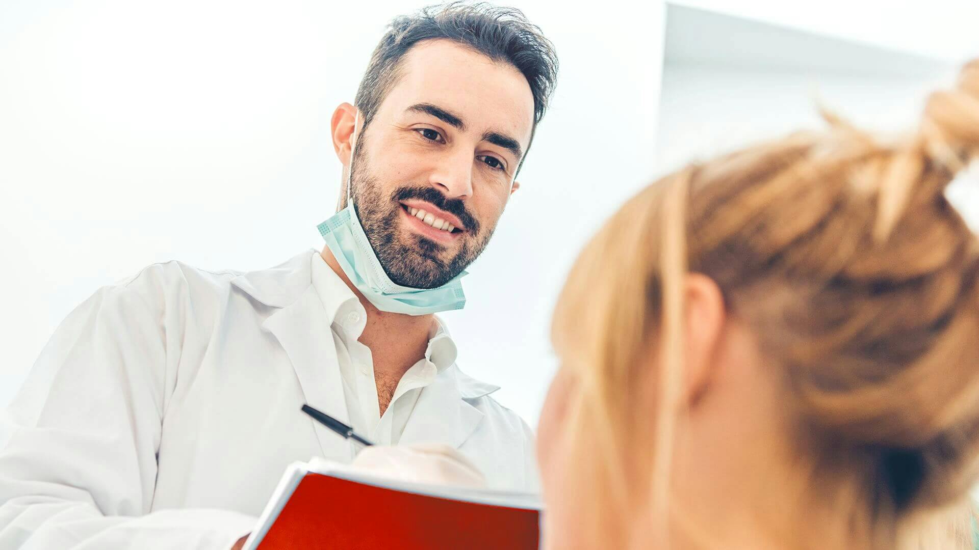 Dentist advising a patient