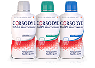 Three bottles of Corsodyl mouthwash, including original, alcohol free and fresh mint