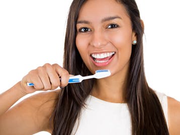 Woman brushing her teeth