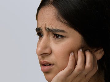 Picture of woman having teeth problems