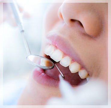 Close up of woman getting teeth cleaned