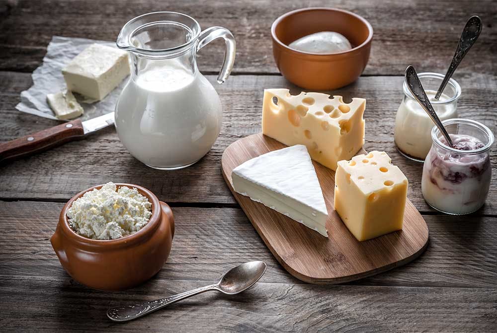 various dairy products on wooden table