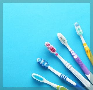 Toothbrushes on blue background