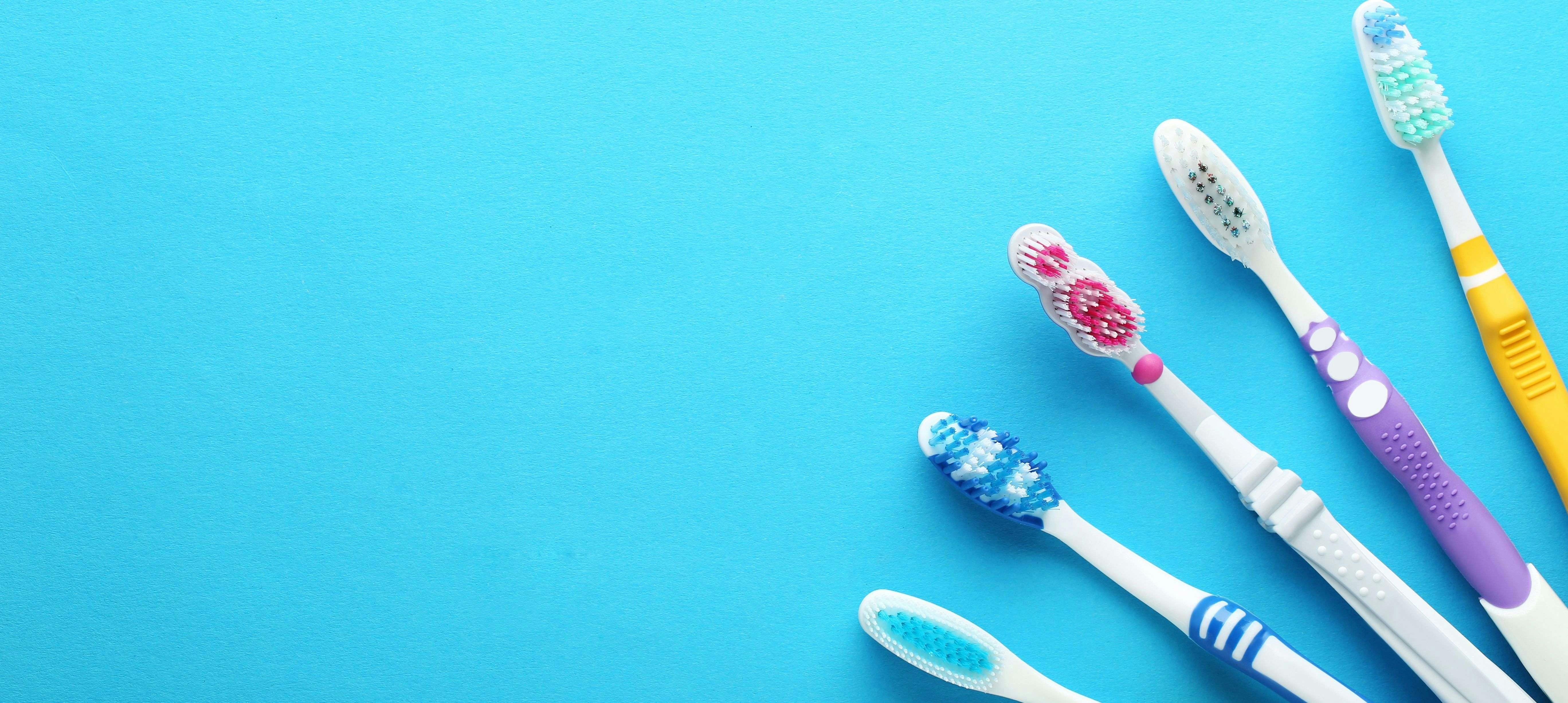 Toothbrushes on blue background