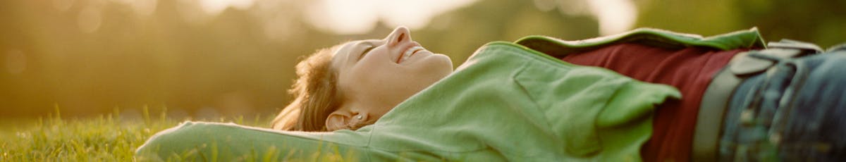 Woman lying in field