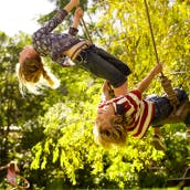 Children playing on swing ropes