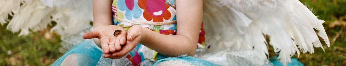 Child Holding an Insect