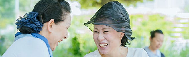What to expect when getting your first dentures header image Woman getting closer to others