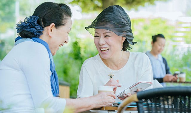 What to expect when getting your first dentures header image Woman getting closer to others