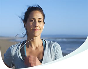 Image of woman running on the beach