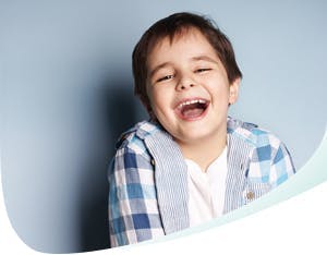 Young boy with wide open smile 