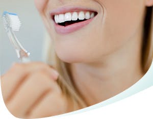 Woman Holding Toothbrush
