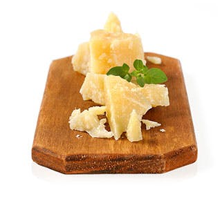 Aged Cheese on a Cutting Board Aged Cheese on a Cutting Board