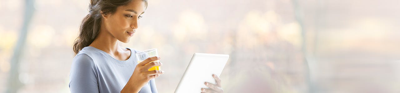 Woman Reading With Juice Header