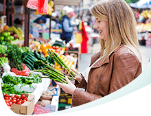 Woman with a White Smile Picking Vegetables