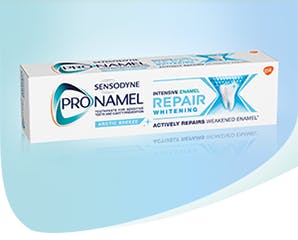 Protecting enamel with a tube of Sensodyne Pronamel Intensive Enamel Repair toothpaste