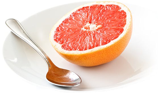 grapefruit and spoon grapefruit and spoon