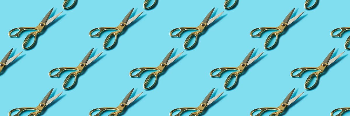 Hair-cutting scissors in a repeating pattern.
