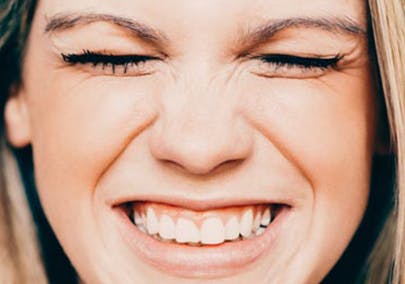 Woman smiling with closed eyes Woman smiling with closed eyes