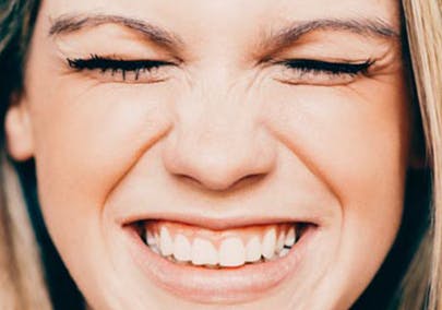 Woman smiling with closed eyes