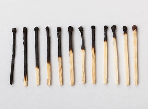 12 matches lying in a row with an ongoing reduced levels of burnt parts