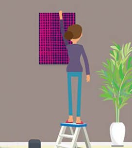 Illustration of a woman hanging a picture on the wall.