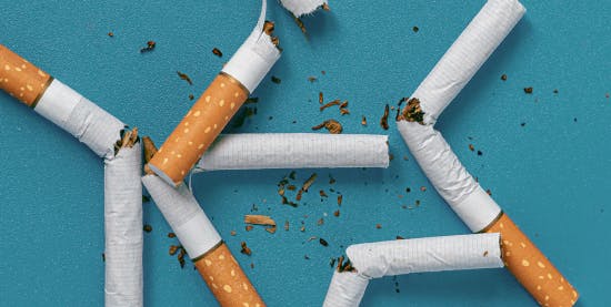 5 broken cigarettes in a pile