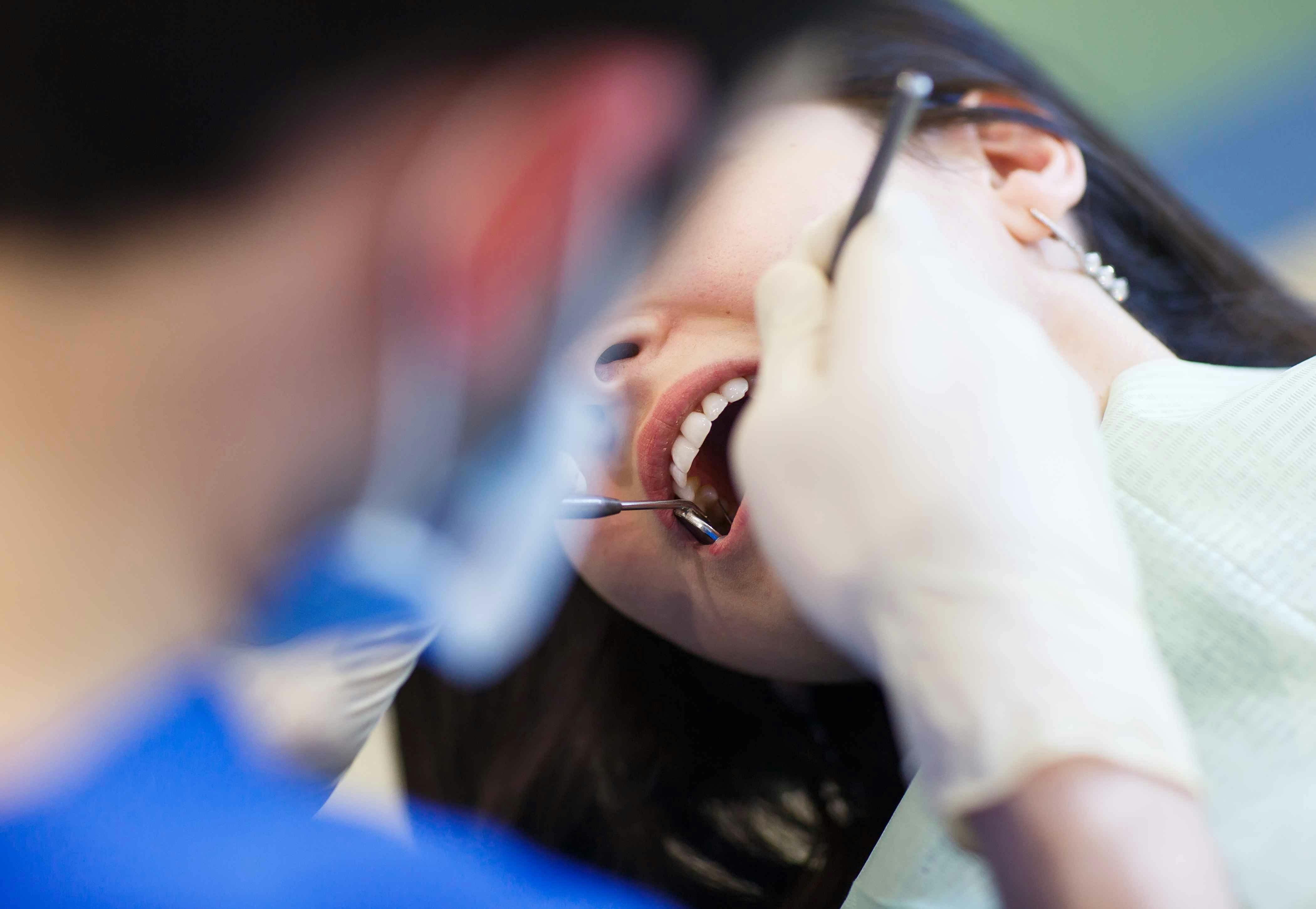 Woman receiving dental treatment