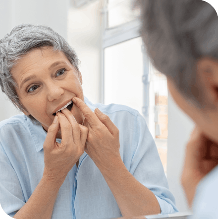 Women checking teeth floss
