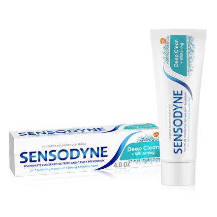 Sensodyne Deep Clean toothpaste for sensitive teeth next to a glass of water
