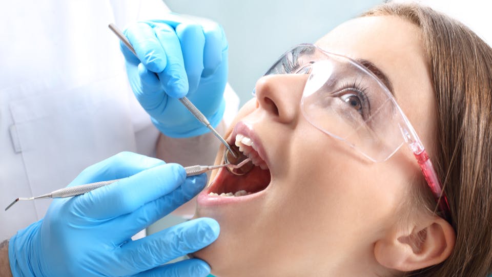 Woman in the dentist's chair during a dental procedure.