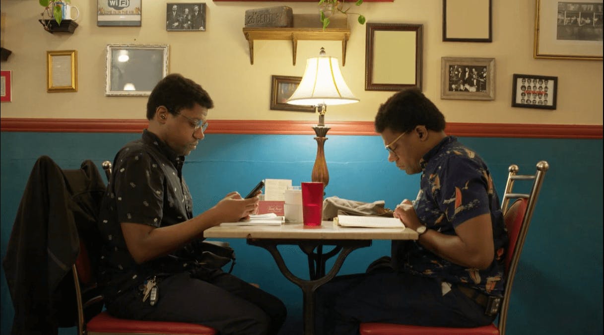 Persons sitting near a table