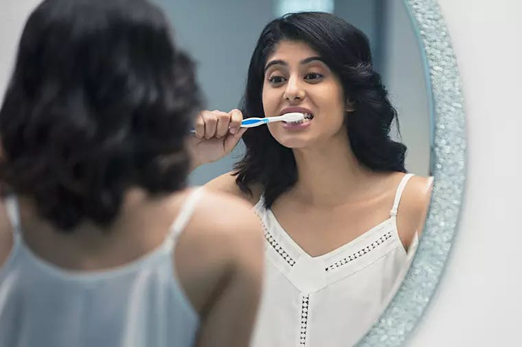 Brushing teeth to maintain healthy teeth