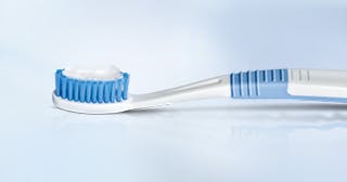 Information promoting brushing teeth daily with a soft-bristled toothbrush and using a fluoride enamel toothpaste
