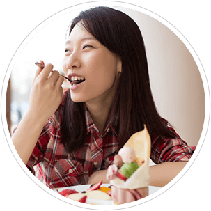 Asian woman eating