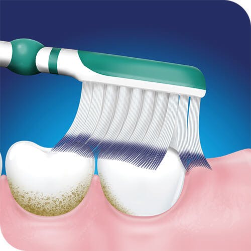 Green duoflex toothbrush head brushing teeth