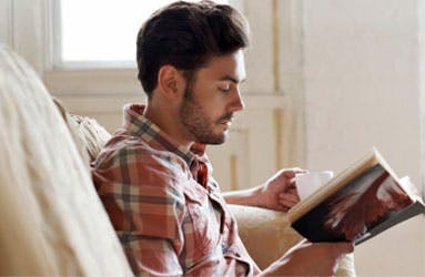 Young man reading a book