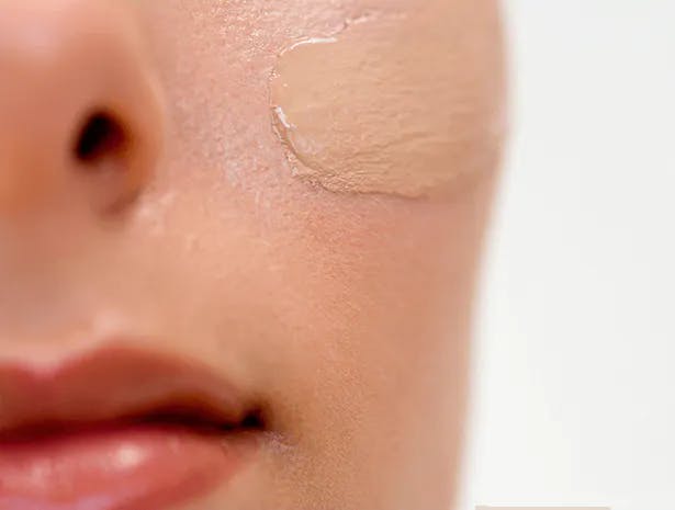 Women having cream on her face